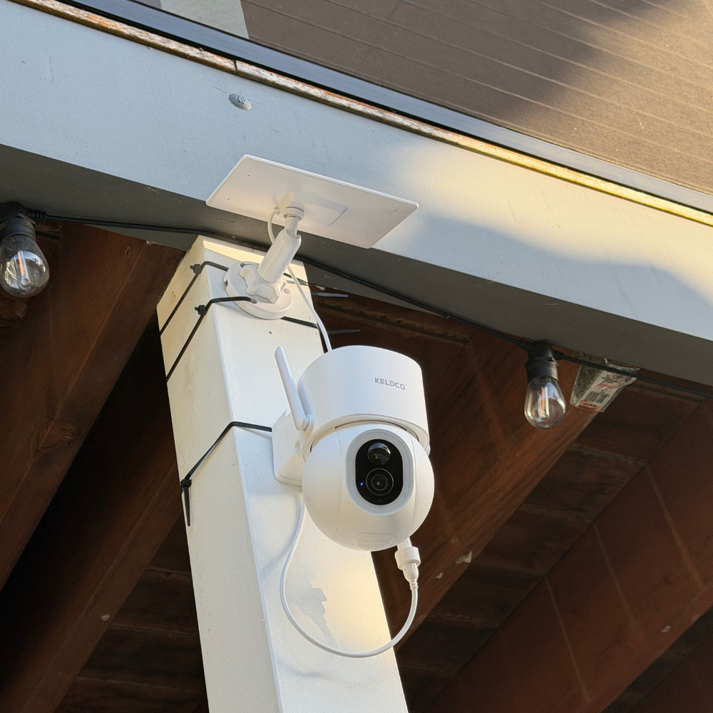 Camera zip-tied to a post