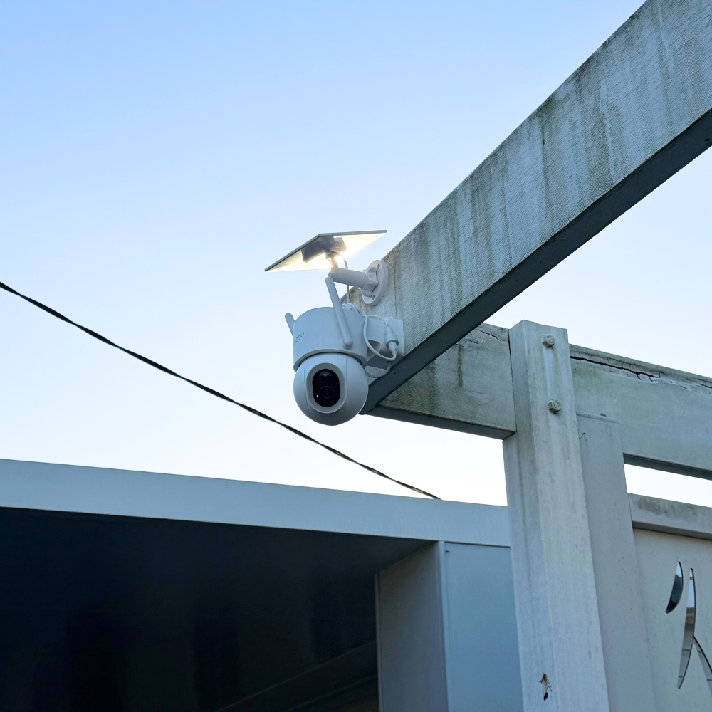 Camera screwed to a pergola beam